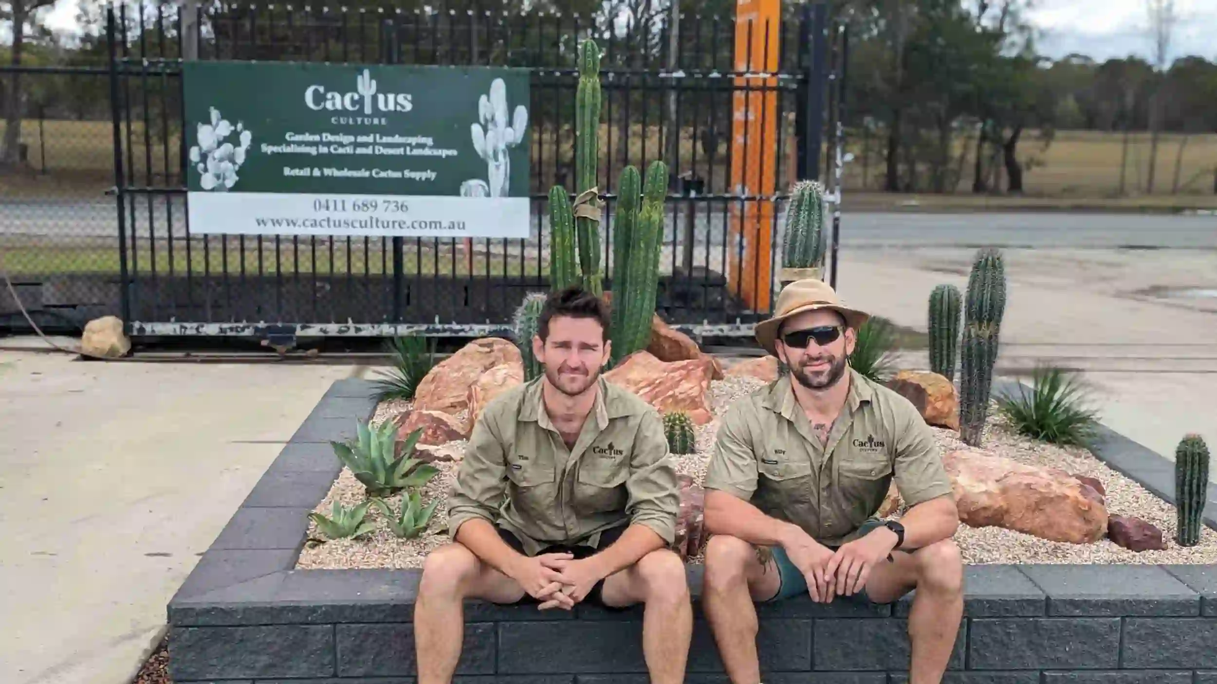 Tim and Billy, owners of Cactus Culture Australia Sitting In Front of their cactus display garden at Rock and Soil landscaping yard in Tingalpa